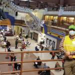 City of Homer Recreation Manager Mike Illg, who is in the planning section of Homers Unified Command Mass Vaccination PODs, stands on the upper level of Homer High School overlooking the Commons during a vaccine clinic on Friday, March 5, 2021 in Homer, Alaska. Providing more than 500 doses of the COVID-19 vaccine to local residents, it was the Unified Commands largest mass clinic to date. (Photo courtesy Derotha Ferraro/South Peninsula Hospital)