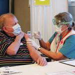 Peter Zuyus receives his first dose of the Moderna vaccine Friday, Jan. 15, 2021 at a large-scale clinic put on by South Peninsula Hospital and the City of Homer at Christian Community Church in Homer, Alaska. (Photo by Megan Pacer/Homer News)