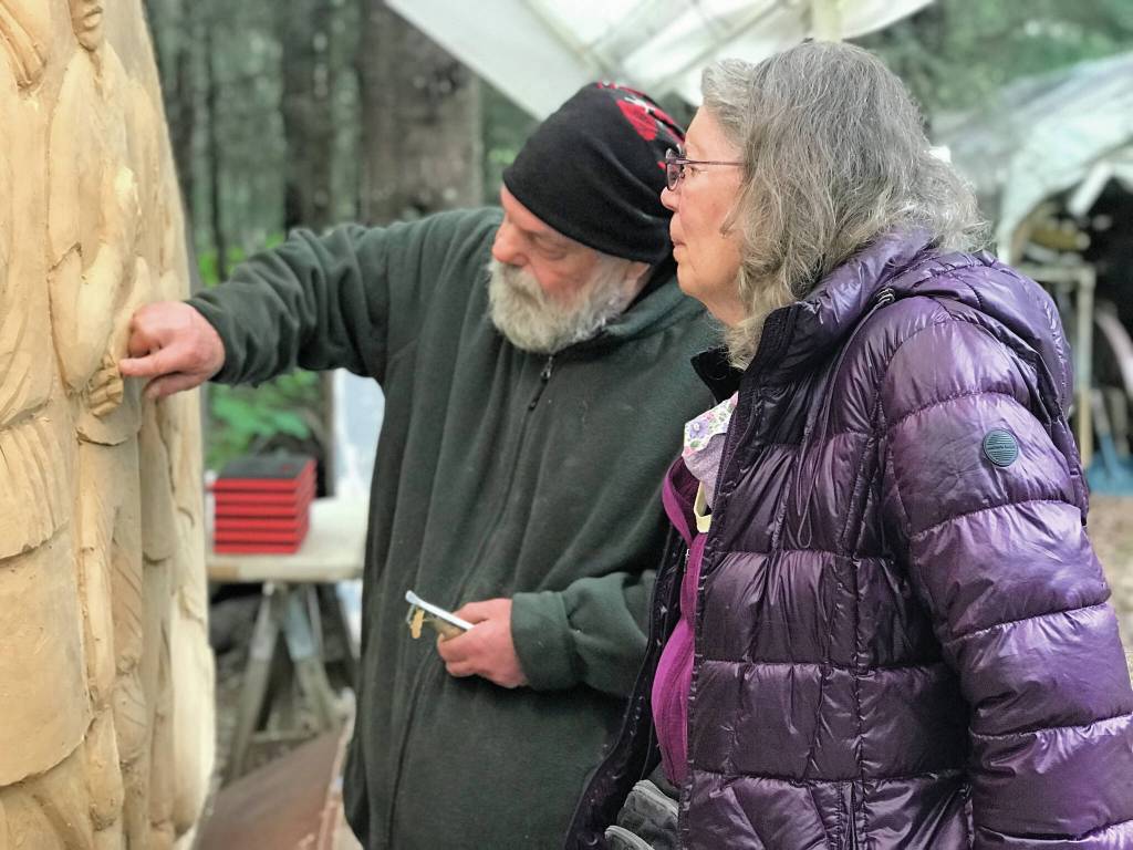 Sara Berg, right, talks with artist Brad Hughes, left, at Hughes Homer, Alaska, studio in June 2021 about the Loved & Lost Memorial Bench project Berg and other family and friends of Anesha Murnane commissioned to honor Murnane and other missing woman and children. (Photo by Christina Whiting)