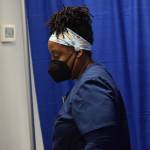 Registered nurse Tina Williams works at the Y vaccine clinic in Soldotna on Wednesday, Dec. 22, 2021. (Camille Botello/Peninsula Clarion)