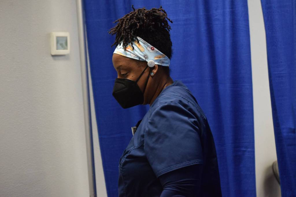 Registered nurse Tina Williams works at the Y vaccine clinic in Soldotna on Wednesday, Dec. 22, 2021. (Camille Botello/Peninsula Clarion)