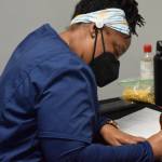 Registered nurse Tina Williams works at the Y vaccine clinic in Soldotna on Wednesday, Dec. 22, 2021. (Camille Botello/Peninsula Clarion)