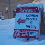 Snow covers the sign on Thursday, Dec. 9, 2021, at the South Peninsula Hospital Bartlett Street COVID-19 testing and vaccination clinic in Homer, Alaska. (Photo by Michael Armstrong/Homer News)