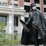 A statue of William Seward wears a mask outside the Alaska Capitol on Monday, May 18, 2020, in Juneau, Alaska. The Alaska Legislature planned to reconvene Monday to address use of federal coronavirus relief funds, with protocols in place aimed at guarding against the virus. (AP Photo/Becky Bohrer)
