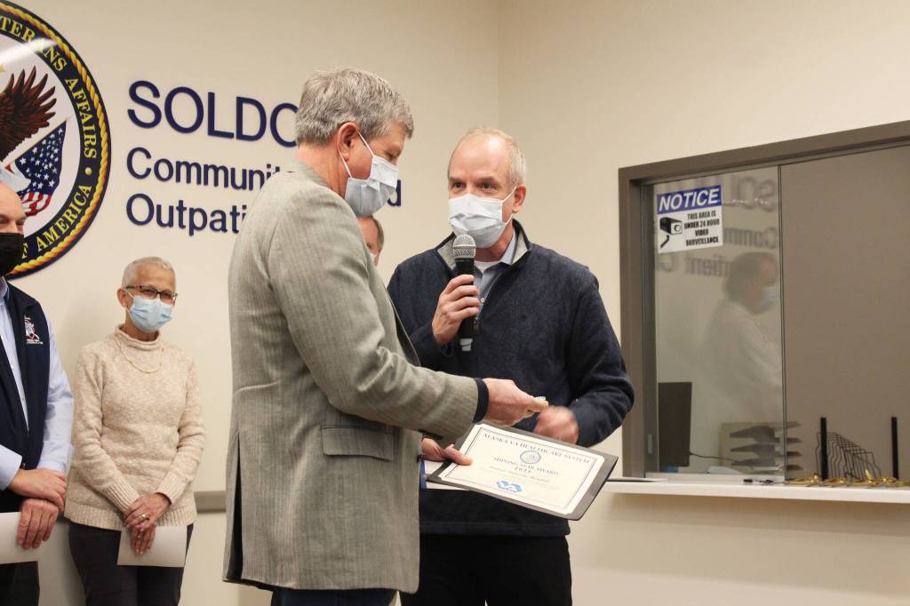 Alaska VA Healthcare System Executive Director Tom Steinbrunner (right) presents Central Peninsula Hospital CEO Rick Davis (left) with an award during a ribbon cutting ceremony on Wednesday, Dec. 29, 2021 in Soldotna, Alaksa. (Ashlyn OHara/Peninsula Clarion)