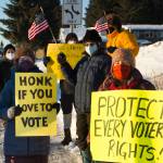 A group of community members gather together on Thursday, Jan. 6 at WKFL Park to protest the insurrection at the U.S. Capitol on the one-year anniversary of the attack. (Photo by Sarah Knapp/Homer News)