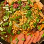 Traditional ingredients like kimchi, ramen and tofu are mixed with American comfort food Spam in this hearty Korean stew. (Photo by Tressa Dale/Peninsula Clarion)