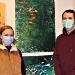 Dana Zigmund / Juneau Empire 
Siblings Lea Skaggs, left, and Drake Skaggs, right, show off work by their brother Avery Skaggs at the opening night of a show at the Juneau-Douglas City Museum featuring a selection of work Avery Skaggs created during the pandemic lockdown. The exhibition is titled Home: Disability Creativity in a Pandemic Lockdown.