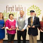 First Lady Rose Dunleavy, far right, and Gov. Mike Dunleavy, far right, pose with the 2021 Volunteer of the Year honorees. From left to right are Gov. Dunleavy, Anna DeVolld, Rachel Sallaffie, John Green, Carl Schrader, Nona Safra, and First Lady Dunleavy. (Photo by Stanley Wright)