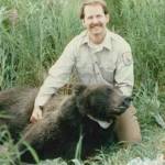 Ed Bangs in 1984  with the first female brown bear radio-collared on the Kenai. (Photo courtesy USFWS)