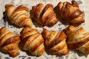 Achieving the crispy, flaky layers of golden goodness of a croissant require precision and skill. (Photo by Tresa Dale/Peninsula Clarion)