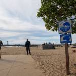 People watch waters rise from Twin Lakes State Beach in Santa Cruz, Calif., Saturday, Jan. 15, 2022.  An undersea volcano has erupted in spectacular fashion near the Pacific nation of Tonga on Saturday.  Following the eruption, a tsunami advisory was issued for Hawaii, Alaska and the U.S. Pacific coast. (AP Photo/Nic Coury)