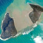 In this satellite photo taken by Planet Labs PBC, an island created by the underwater Hunga Tonga Hunga Ha'apai volcano is just before a massive eruption Saturday, Jan. 15, 2022. An undersea volcano erupted in spectacular fashion near the Pacific nation of Tonga on Saturday, sending large tsunami waves crashing across the shore and people rushing to higher ground. A tsunami advisory was in effect for Hawaii, Alaska and the U.S. Pacific coast, with reports of waves pushing boats up in the docks in Hawaii. (Planet Labs PBC via AP)