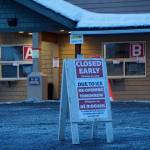 Photo by Michael Armstrong/Homer News
A sign warns of icy conditions in the parking lot of the Bartlett Street COVID-19 vaccine and testing clinic on Thursday, Jan. 13, in Homer. The clinic closed early that day to de-ice the lot.