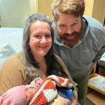 Cassy Quinlan, left, holds her new daughter, Betty Lynn Fraley, while father Jacob Fraley, right, watches on Wednesday, Jan. 19, 2022, at South Peninsula Hospital in Homer, Alaska. Betty Lynn was born on Jan. 17, 2022, the first baby of the New Year. (Photo courtesy of South Peninsula Hospital)