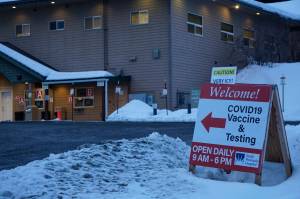 A sign warns of icy conditions in the parking lot of the Bartlett Street COVID-19 vaccine and testing clinic on Thursday, Jan. 13, 2022, in Homer, Alaska. (Photo by Michael Armstrong/Homer News)