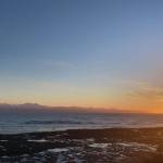 The sun sets over Kachemak Bay as seen from Ocean Drive Loop on Tuesday, Jan. 25. (Photo by Sarah Knapp/Homer News)