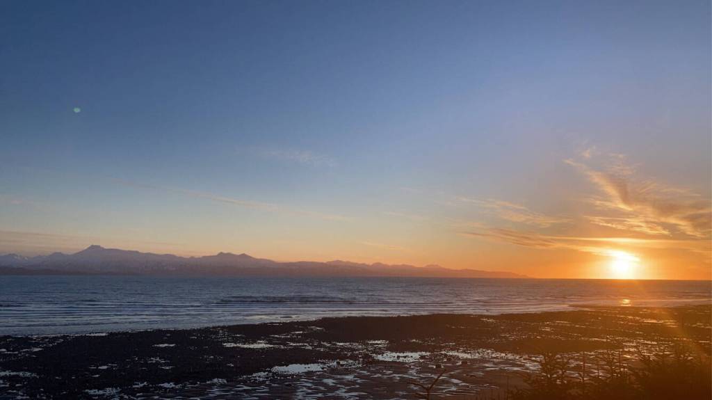 The sun sets over Kachemak Bay as seen from Ocean Drive Loop on Tuesday, Jan. 25. (Photo by Sarah Knapp/Homer News)