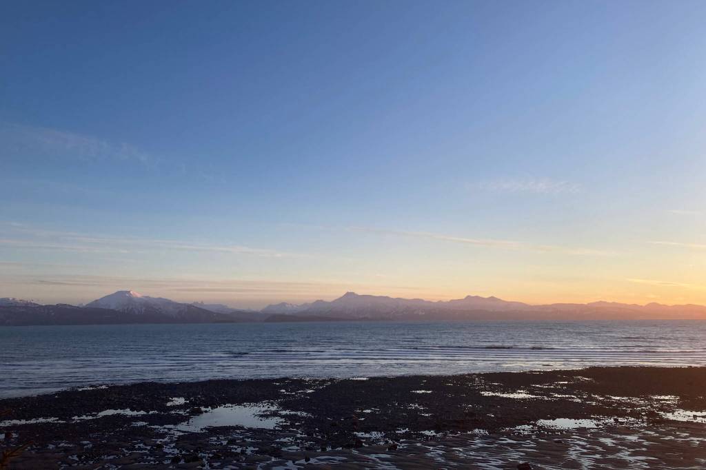 The sun sets over Kachemak Bay as seen from Ocean Drive Loop on Tuesday, Jan. 25. (Photo by Sarah Knapp/Homer News)