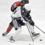 Soldotnas Boone Theiler battles for the puck against Houston on Thursday, Jan. 20, 2022, at the Soldotna Regional Sports Complex in Soldotna, Alaska. (Photo by Jeff Helminiak/Peninsula Clarion)