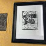 A print is on display at the Kenai Art Center on Monday, Jan. 31, 2022. (Camille Botello/Peninsula Clarion)