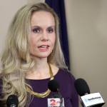 FILE - In this Sept. 26, 2019, file photo, Kelly Tshibaka speaks to reporters in Anchorage. Law enforcement officials have completed their investigation whether Tshibaka, a U.S. Senate candidate and former State of Alaska official, illegally obtained a fishing license for a sportfishing event two years ago, and turned it over to a special prosecutorial branch of the Department of Law, an official said Thursday, Aug. 19. (AP Photo / Mark Thiessen)