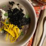 A traditional dish of the Lunar New Year, rice cake soup features beef, rice cakes, green onions, toased sushi nori and eggs. (Photo by Tressa Dale/Peninsula Clarion)