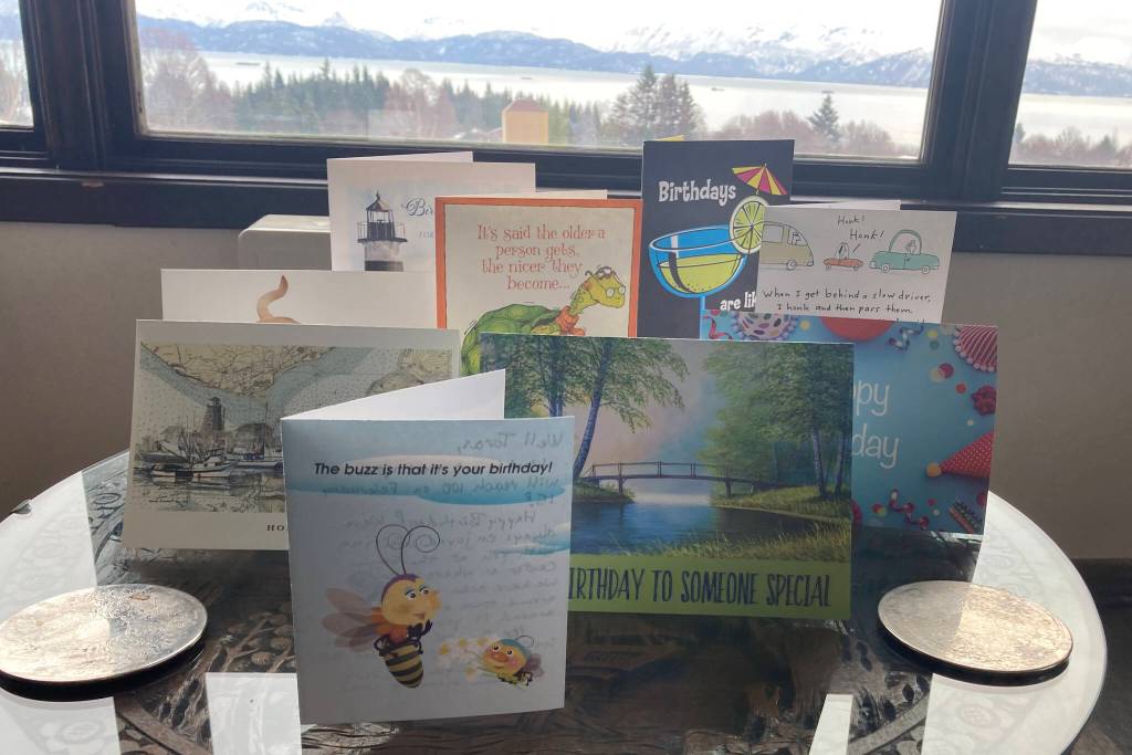 Birthday cards celebrating Toras Fisks 100th birthday fill all of the available counter space in his home. (Photo by Sarah Knapp/Homer News)