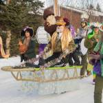 Participants of the Krewe of Gambrinus parade dressed up in a sled in honor of the upcoming Iditarod race. (Photo by Sarah Knapp/Homer News)