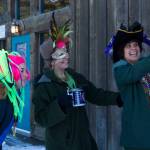 These three ladies are all smiles for the Krewe of Gambrinus Winter Carnival and Mardi Gras parade. (Photo by Sarah Knapp/Homer News)