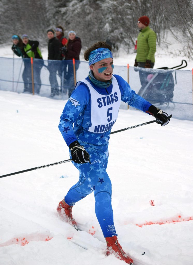 Soldotnas Quinn Cox finishes the boys 7.5-kilometer class mass start Saturday, Feb. 12, 2022, at the Region III ski championships at Tsalteshi Trails just outside of Soldotna, Alaska. (Photo by Camille Botello/Peninsula Clarion)