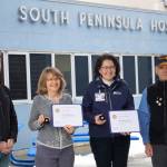 South Peninsula Hospital Laboratory Director Laura Miller, second from left, and SPH Director of Marketing and Public Relations Derotha Ferraro, second from right, were honored by the Rotary Club of Homer-Kachemak Bay on Thursday, Feb. 17, at South Peninsula Hospital in Homer, Alaska, for their contributions to the health of southern Kenai Peninsula communities. Presenting the awards were Bernie Griffard, club president, far right, and Van Hawkins, co-chair of the annual Rotary Health Fair. (Photo by Michael Armstrong/Homer News)