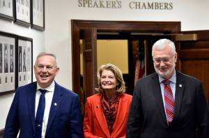 Peter Segall / Juneau Empire
Alaska Rep. Bryce Edgmon, I-Dillingham, left, and Sen. Gary Stevens, R-Kodiak, right, escort U.S. Sen Lisa Murkowski, R-Alaska, into the chambers of the Alaska House of Representatives for her annual address to lawmakers on Tuesday.