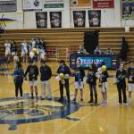 Mariner seniors line up with their parents or friends at the Homer vs. Nikiski basketball game on Friday, Feb. 25, 2002, in the Alice Witte Gym at Homer High School, Homer, Alaska. From left to right are Tyson Walker (cheer) and Lauren Harris (cheer); Stephanie Carroll, Ryan Carroll (Player) and Weston Carroll; Tim Hatfield, Timmy Hatfield (player) and Gina Pelaia; Noah Irons (player); Joy Huffman, Braden Huffman (player) and Jason Huffman(Photo by Michael Armstrong/Homer News)