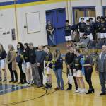 Photo by Michael Armstrong/Homer News
Lady Mariner seniors line up with their parents at the Homer vs. Nikiski basketball game on Friday, Feb. 25, 2002, in the Alice Witte Gym at Homer High School, Homer, Alaska. From lft to right are Steve Glasman, Olivia Glasman (player) and Claudia Haines; Derotha Ferraro, Delilah Harris (player) and Gary Harris; Jeff Erickson, Sophie Ellison (Player) and Shari Ellison; Jamin Morris, Melanie Morris (player) and Cate Morris; and Elton Anderson, Kaylin Anderson (player) and Monica Anderson.