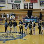 Photo by Michael Armstrong/Homer News
Mariner seniors line up with their parents or friends at the Homer vs. Nikiski basketball game on Friday, Feb. 25, 2002, in the Alice Witte Gym at Homer High School, Homer, Alaska. From left to right are Tyson Walker (cheer) and Lauren Harris (cheer); Stephanie Carroll, Ryan Carroll (Player) and Weston Carroll; Tim Hatfield, Timmy Hatfield (player) and Gina Pelaia; Noah Irons (player); Joy Huffman, Braden Huffman (player) and Jason Huffman.