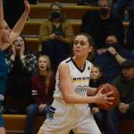 Lady Mariner Mel Morris tries to move around a Nikiski Bulldog during Senior Night on Friday, Feb. 25, 2022, at the Alice Witte Gym at Homer High School in Homer, Alaska. (Photo by Michael Armstrong/Homer News)