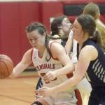 Kenai Centrals Logan Satathite dribbles against Soldotnas Josie Sheridan on Friday, Feb. 25, 2022, at Kenai Central High School in Kenai, Alaska. (Photo by Jeff Helminiak/Peninsula Clarion)
