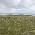 Tundra with Izembek Lagoon and Amak Island in the distance taken at Izembek National Wildlife Refuge. (Photo by B. Wishnek/USFWS)