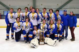 The Glacier Kings 18MU hockey team pose for a photo after winning the state championship on Monday, March 14, 2022, at the MTA Events Center in Wasilla, Alaska. In the back row, from left to right, are Aiden Arno, Brock Barth, Casey Otis, Hunter Green, Matfey Reutov, Seamus Hatton, Makary Reutov, River Henry, Walden Kraszeski, Coach Chris Owen, Coach Joanna Owen. In the front row, from left to right, are Micah Williamson, Kazden Stineff, Goalie Keegan Strong, Owen Pitzman, Jordan Barrowcliff and Ethan Drake. (Photo by Stephanie Pitzman)