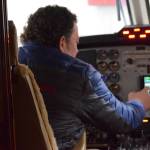 Joel Caldwell, director of operations for Kenai Aviation, sits in the pilots seat of Kenai Aviations nine-seat Beechcrafter Super King Air B200 plane in Kenai, Alaska, on Wednesday, March 9, 2022. (Camille Botello/Peninsula Clarion)