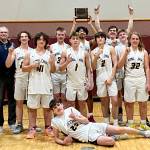 The Ninilchik boys celebrate the Interior Conference title Friday, March 11, 2022, in Tok, Alaska. (Photo provided by team)