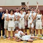 The Ninilchik boys celebrate the Interior Conference title Friday, March 11, 2022, in Tok, Alaska. (Photo provided by team)