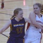 Kenai Centrals Emma Beck keeps the ball from Olivia Glasman on Saturday, March 12, 2022, at the Peninsula Conference tournament at Kenai Central High School in Kenai, Alaska. (Photo by Jeff Helminiak/Peninsula Clarion)
