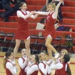 The Kenai Central cheerleading team leads a cheer Saturday, March 12, 2022, at Kenai Central High School in Kenai, Alaska. The Kards were the top team at the Peninsula Conference tournament. (Photo by Jeff Helminiak/Peninsula Clarion)