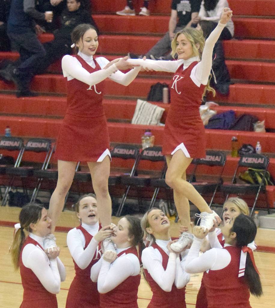 The Kenai Central cheerleading team leads a cheer Saturday, March 12, 2022, at Kenai Central High School in Kenai, Alaska. The Kards were the top team at the Peninsula Conference tournament. (Photo by Jeff Helminiak/Peninsula Clarion)