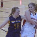 Kenai Central's Emma Beck keeps the ball from Olivia Glasman on Saturday, March 12, 2022, at the Peninsula Conference tournament at Kenai Central High School in Kenai, Alaska. (Photo by Jeff Helminiak/Peninsula Clarion)