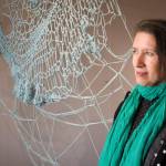 Bunnell Street Arts Center visiting artist-in-residence Berith Stennabb poses next to one of her pieces, Anomicholistic ar.35. (Photo by Sean McDermott)