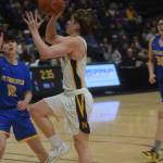 Landon Colburn takes a shot against Metlakatla during the 2A state basketball championship game at the Alaska Airlines Center in Anchorage, Alaska on Saturday, March 19, 2022. (Camille Botello/Peninsula Clarion)