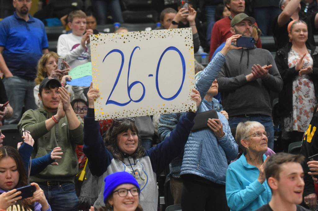 Ninilchik fans cheer on the Wolverines during the Class 2A state basketball championship game at the Alaska Airlines Center in Anchorage, Alaska, on Saturday, March 19, 2022. (Camille Botello/Peninsula Clarion)